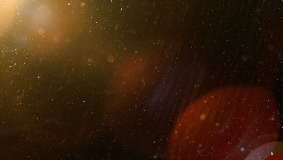 Ethereal glowing dust particles with lens flare