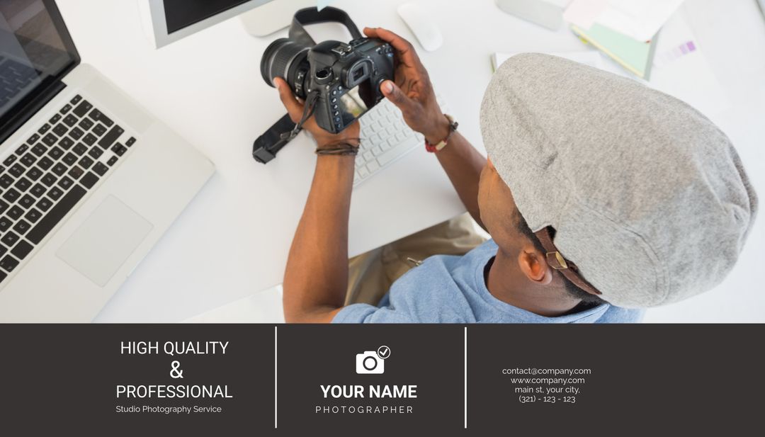 Photographer Editing Photos on Camera at Workstation