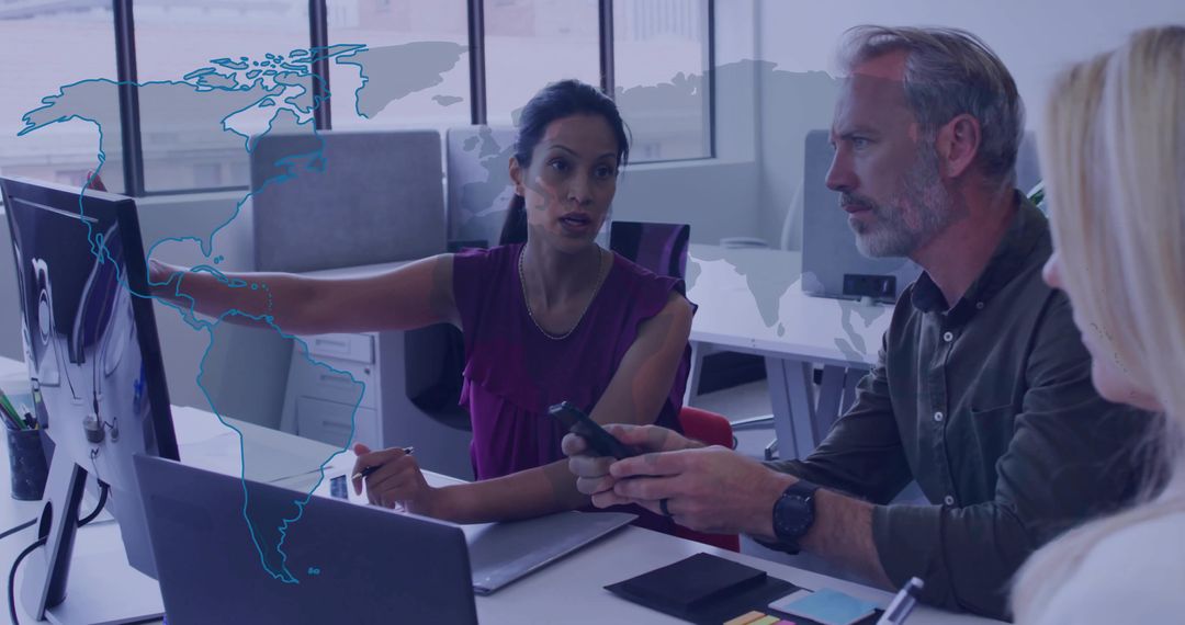 Business Professionals Collaborating in Modern Office with World Map Display