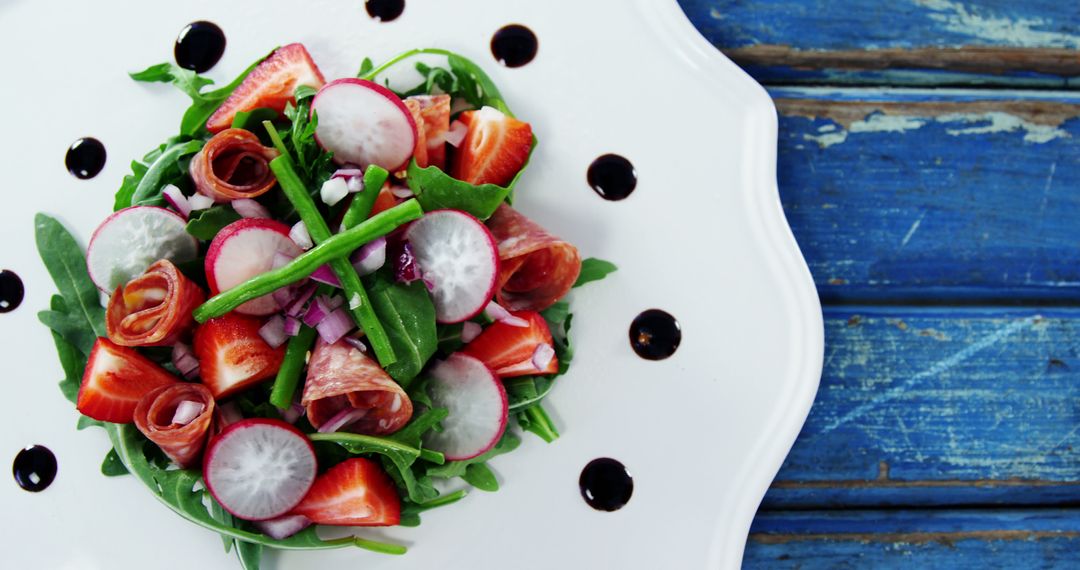 Gourmet Salad with Arugula, Fresh Radish and Sliced Strawberries