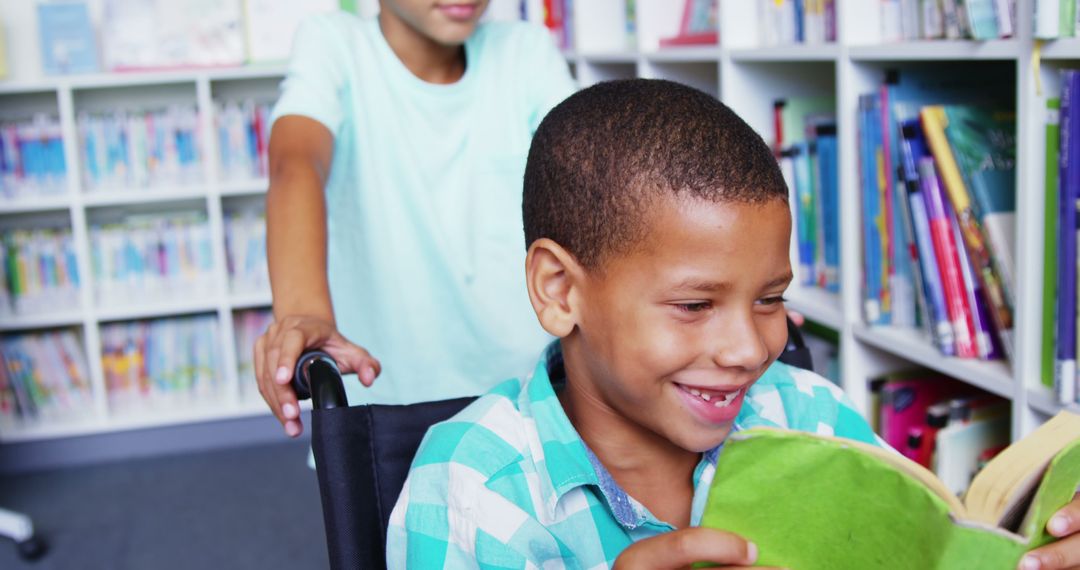 Smiling Child in Wheelchair with Friend in Library Studying Books