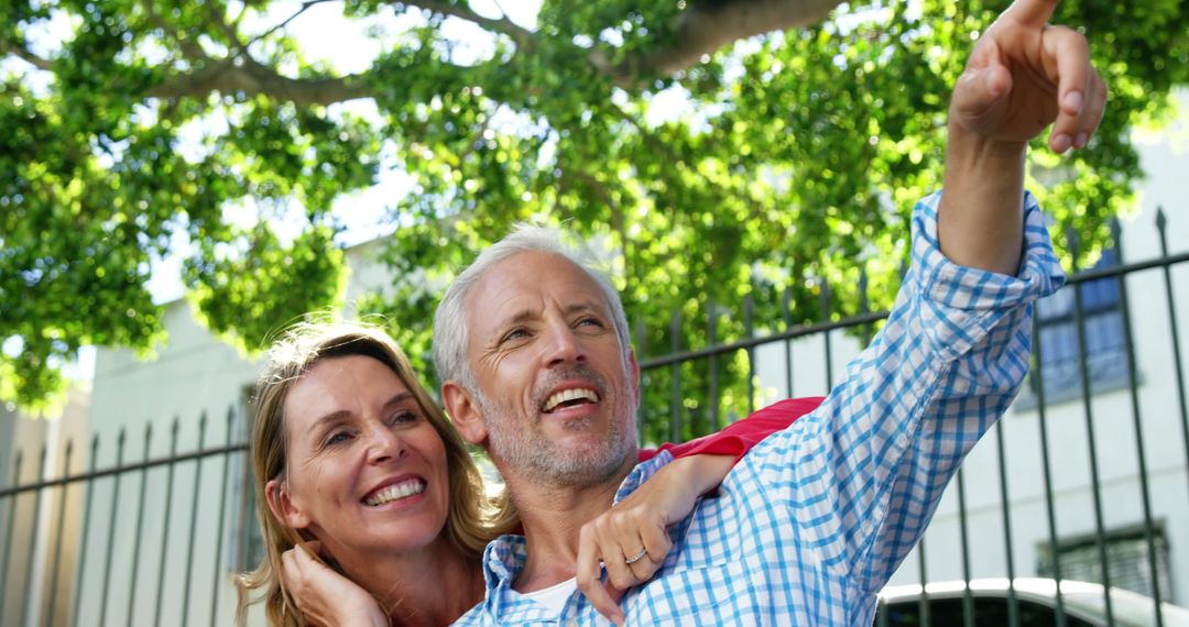 Happy Senior Couple Enjoying Outdoors Holding Each Other - Free Images, Stock Photos and Pictures on Pikwizard.com