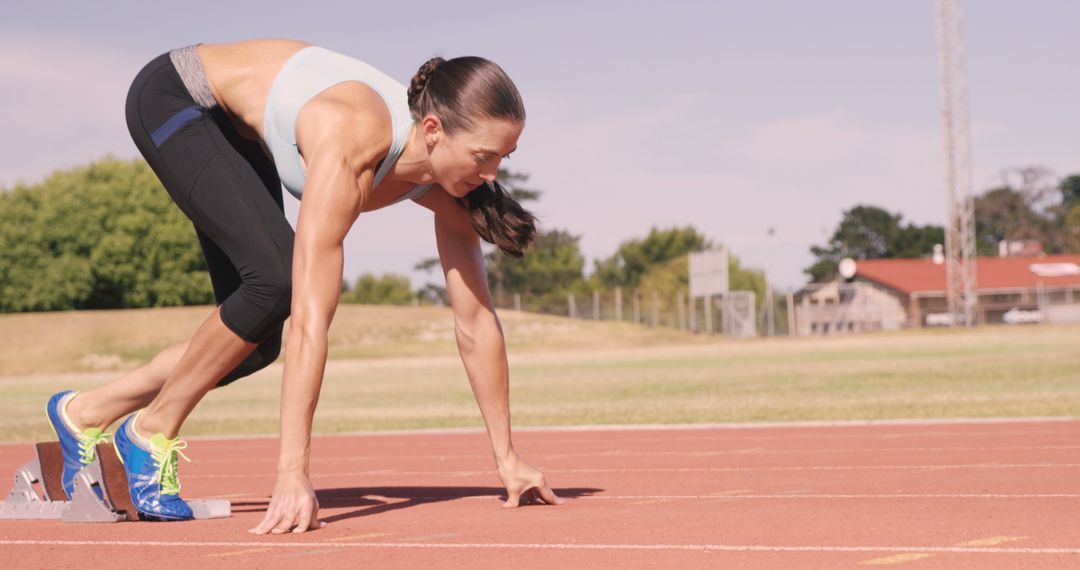 Female Sprinter Prepares to Start Running on Track - Free Images, Stock Photos and Pictures on Pikwizard.com