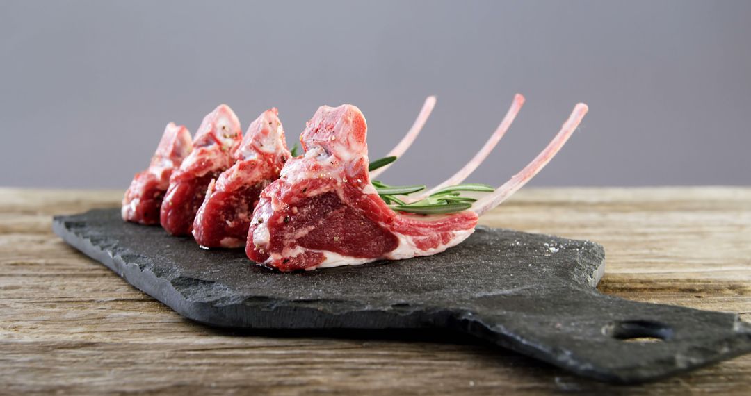 Fresh Raw Lamb Chops with Rosemary Garnish on Slate Board - Free Images, Stock Photos and Pictures on Pikwizard.com