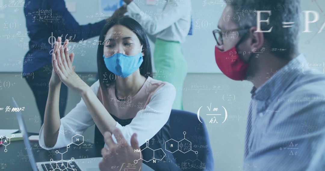 Mask-Wearing Researchers Collaborating on Science Project