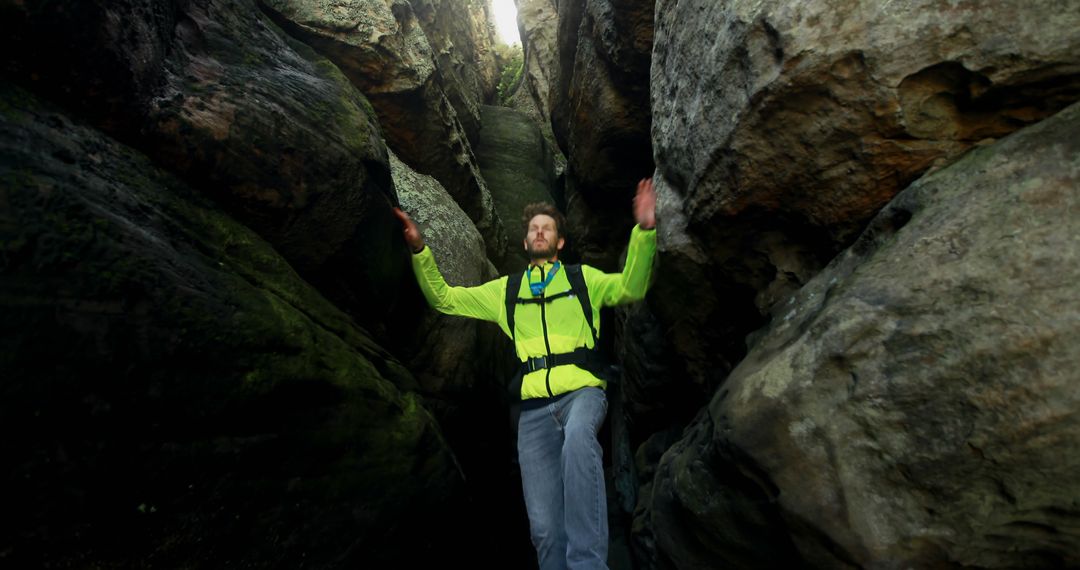 Hiker Exploring Narrow Rocky Canyon Passage - Free Images, Stock Photos and Pictures on Pikwizard.com