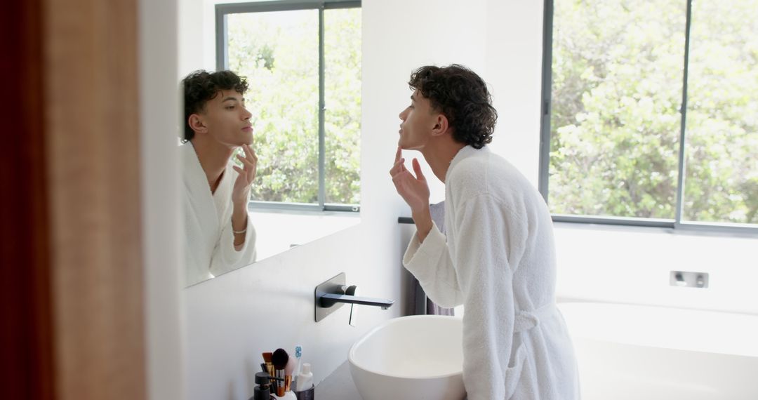 Man Examining Face in Bathroom Mirror