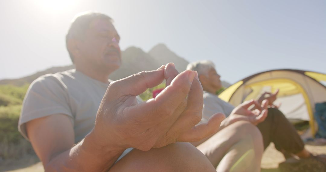 Elderly Men Practicing Meditation Outdoors at Campsite - Free Images, Stock Photos and Pictures on Pikwizard.com