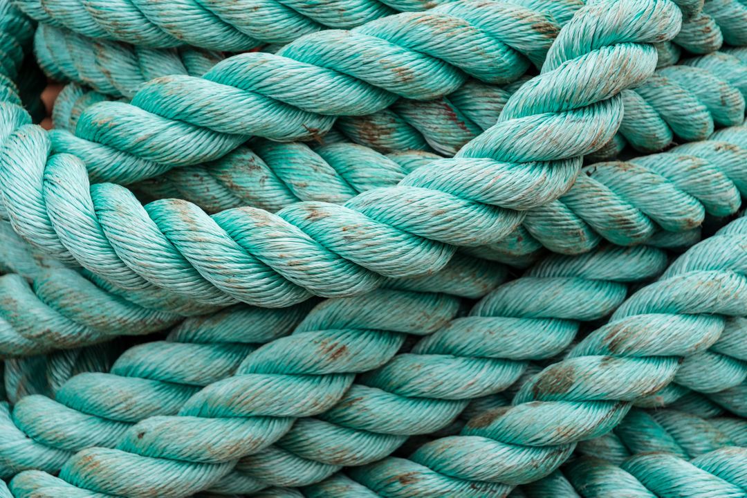 Close-up of Heavy-Duty Twisted Blue Rope with Rustic Texture - Free Images, Stock Photos and Pictures on Pikwizard.com