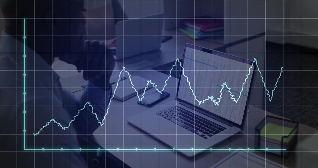 Analyzing Data Trends on Laptop in Corporate Workspace