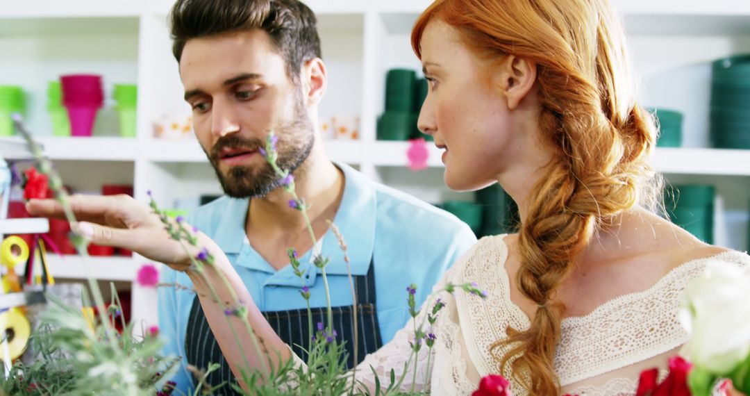 Male Florist Assisting Customer in Flower Shop - Free Images, Stock Photos and Pictures on Pikwizard.com