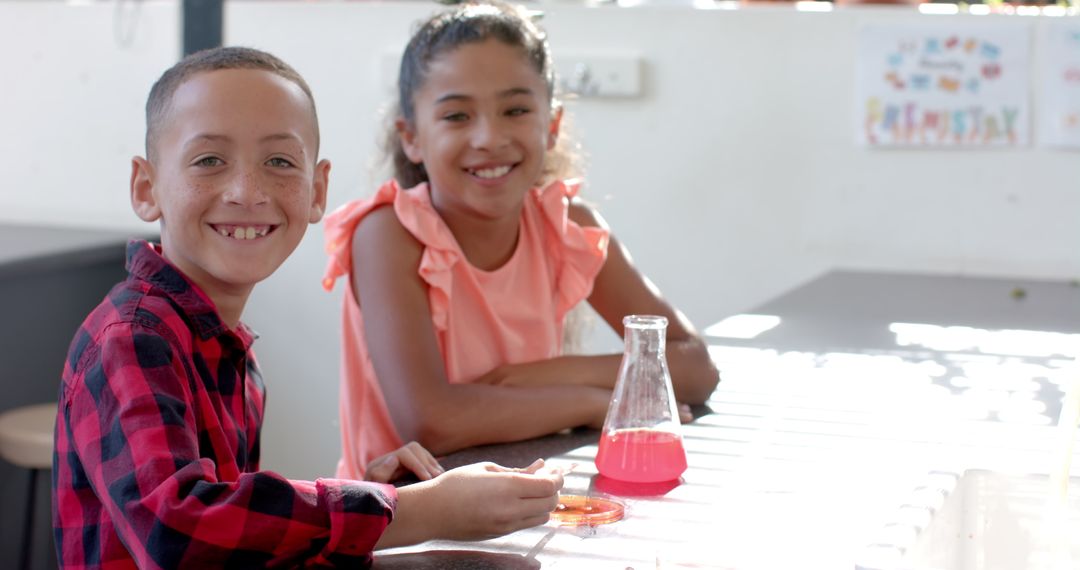 Smiling Kids in Classroom Exploring Chemistry Experiment Together
