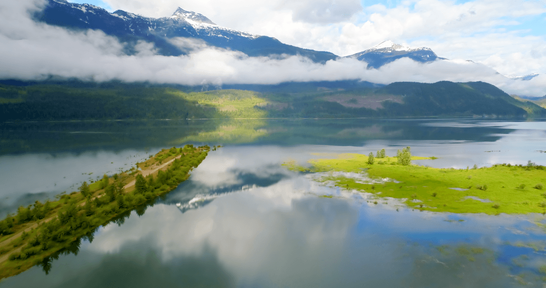 Transparent Mist Over Serene Lake and Majestic Mountains