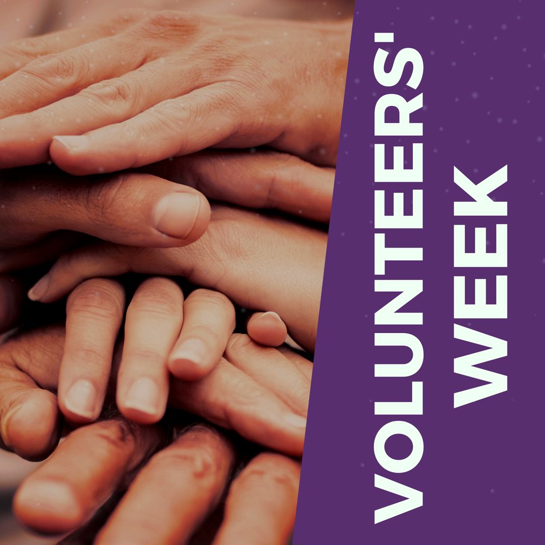 Volunteers Uniting Hands Symbolizing Teamwork and Community