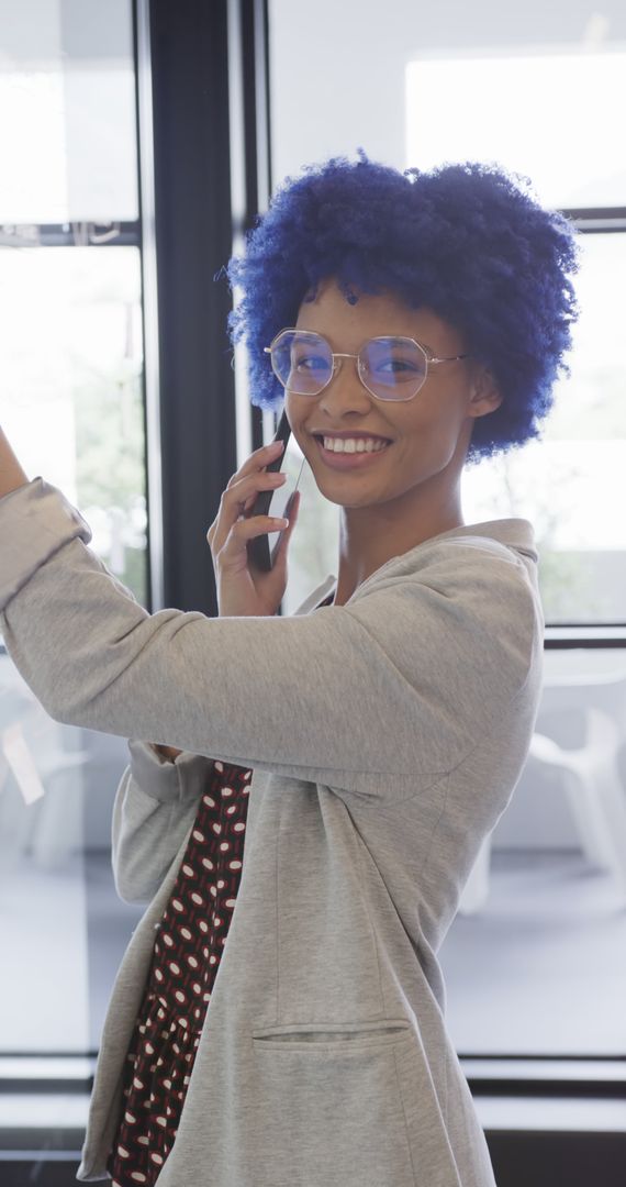 Young Woman with Blue Hair Taking Selfie in Office Setting - Free Images, Stock Photos and Pictures on Pikwizard.com