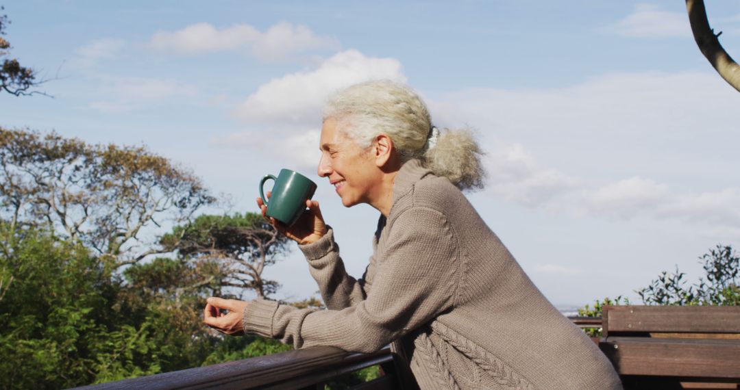 Senior Woman Enjoying Coffee on Outdoor Terrace - Free Images, Stock Photos and Pictures on Pikwizard.com