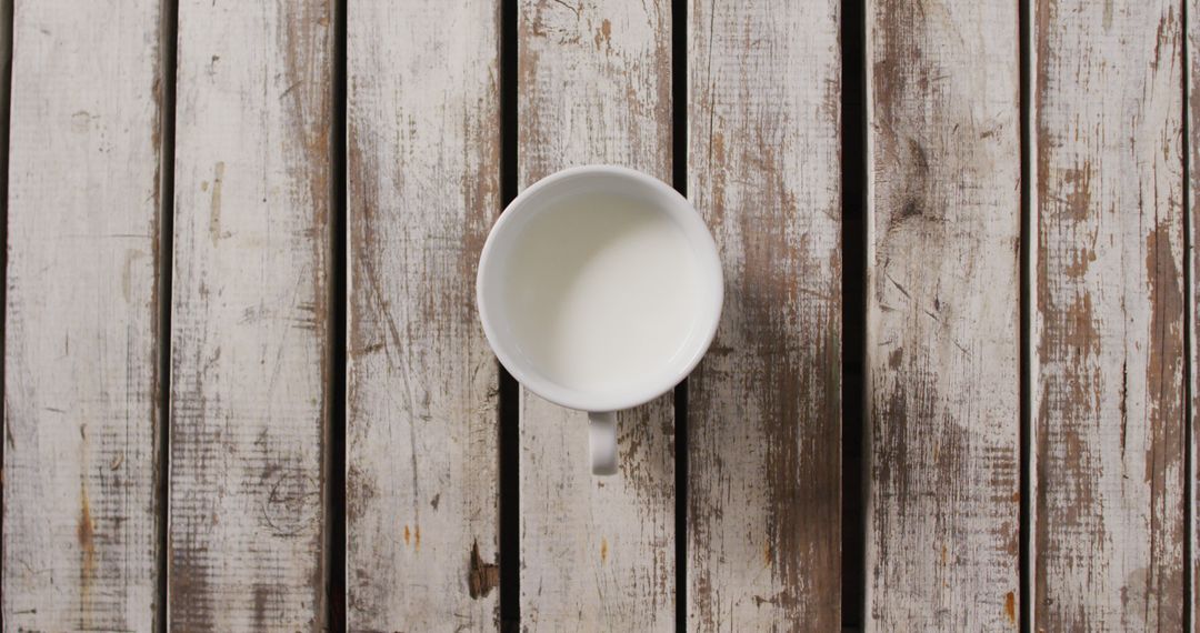 White Mug with Milk on Rustic Wooden Background - Free Images, Stock Photos and Pictures on Pikwizard.com