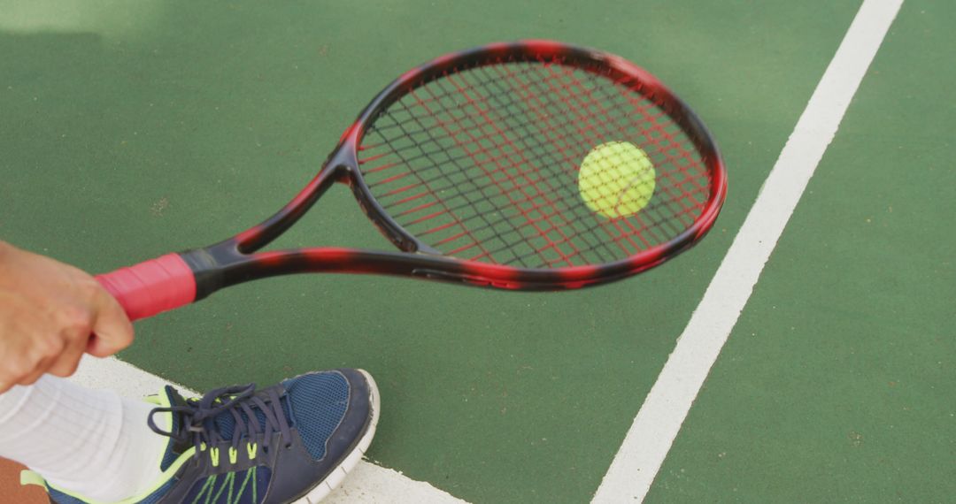 Tennis Player Serving Ball on Court - Free Images, Stock Photos and Pictures on Pikwizard.com