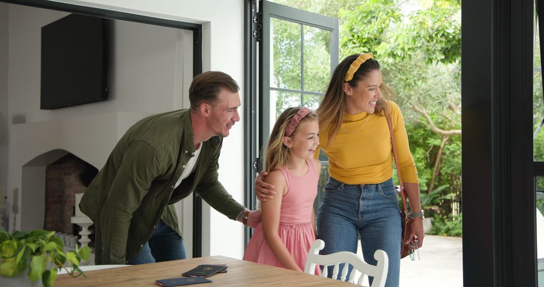 Happy Family Returning Home Embracing and Smiling Together