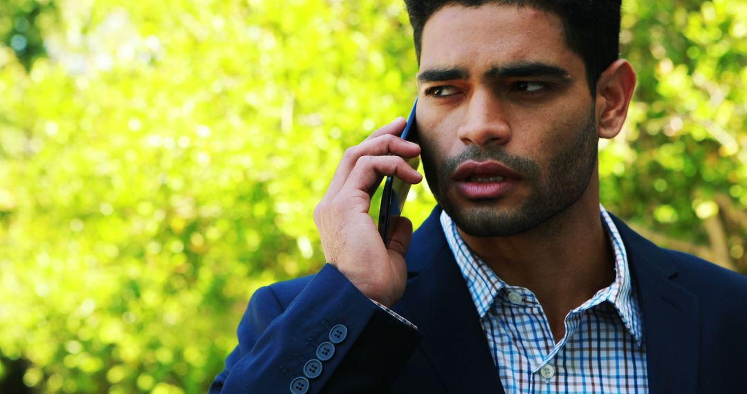 Worried Man in Business Suit Using Smartphone Outdoors - Free Images, Stock Photos and Pictures on Pikwizard.com