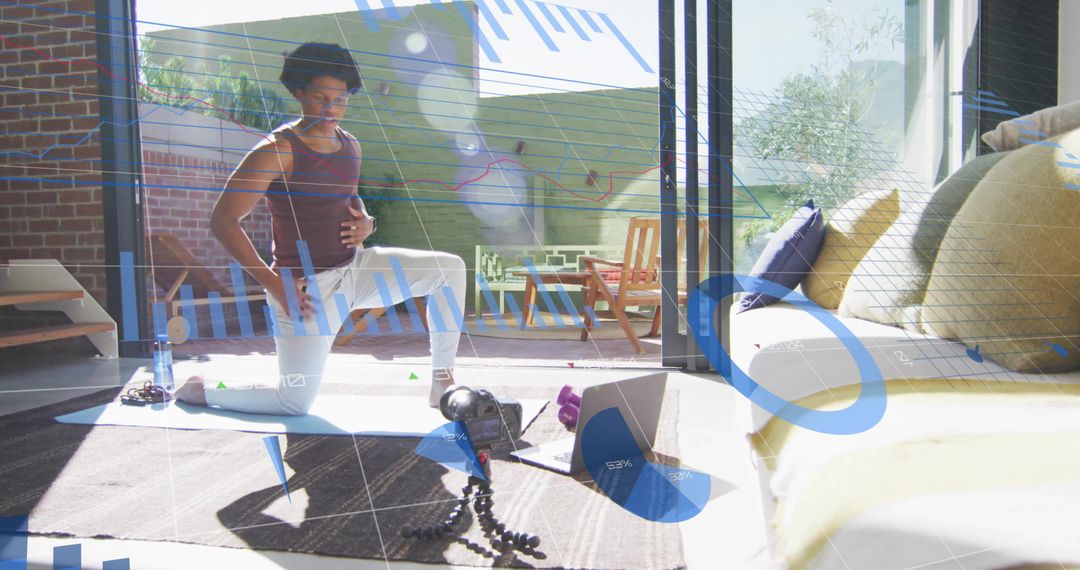 Man Practicing Yoga and Recording Fitness Routine in Modern Living Space