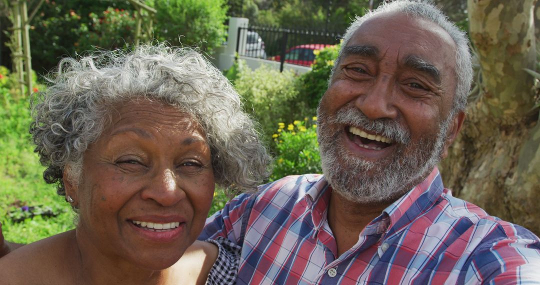 Image of african american senior couple smiling at camera in garden - Free Images, Stock Photos and Pictures on Pikwizard.com
