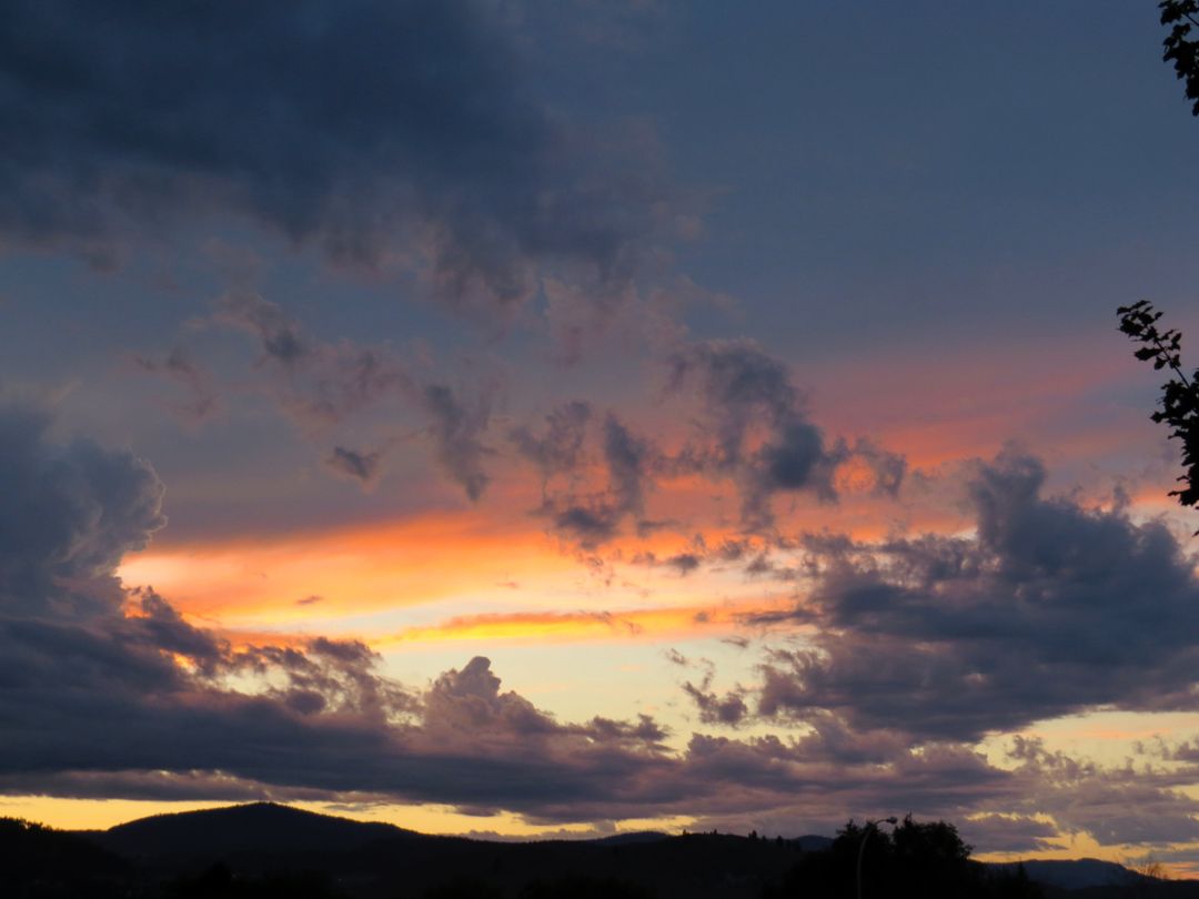 Stunning Sunset Over Mountain Landscape with Vibrant Clouds - Free Images, Stock Photos and Pictures on Pikwizard.com