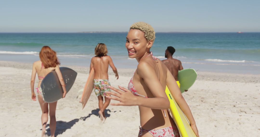 Group of Friends Enjoying Surfing at Beach on Sunny Day - Free Images, Stock Photos and Pictures on Pikwizard.com