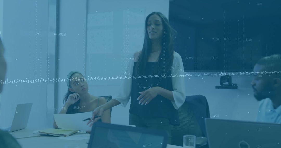 Diverse Team Discussing Strategy in Corporate Meeting Room