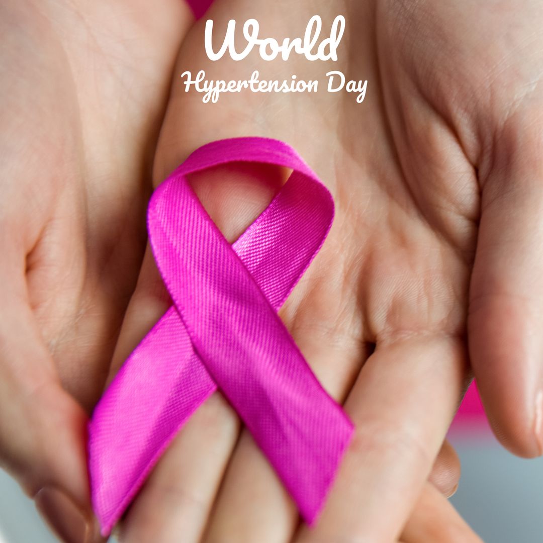 Hands Holding Pink Ribbon for Hypertension Awareness