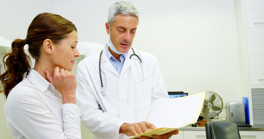 Doctor Consulting Female Patient in Modern Clinic - Free Images, Stock Photos and Pictures on Pikwizard.com