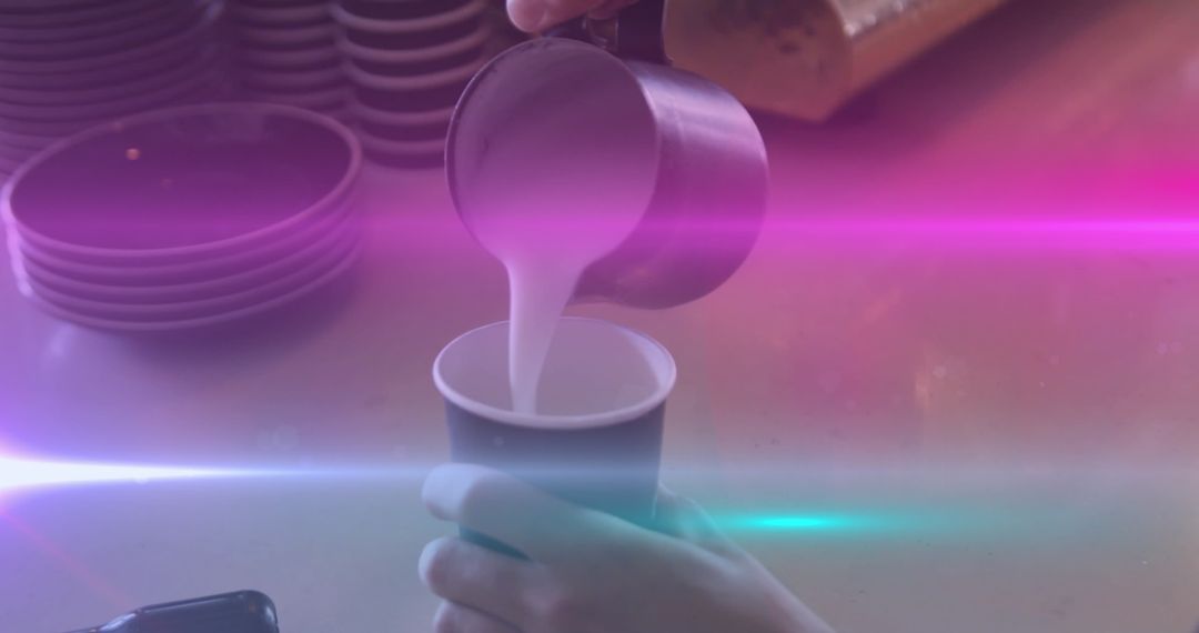 Caucasian Man Pouring Milk into Coffee with Colorful Light Effects