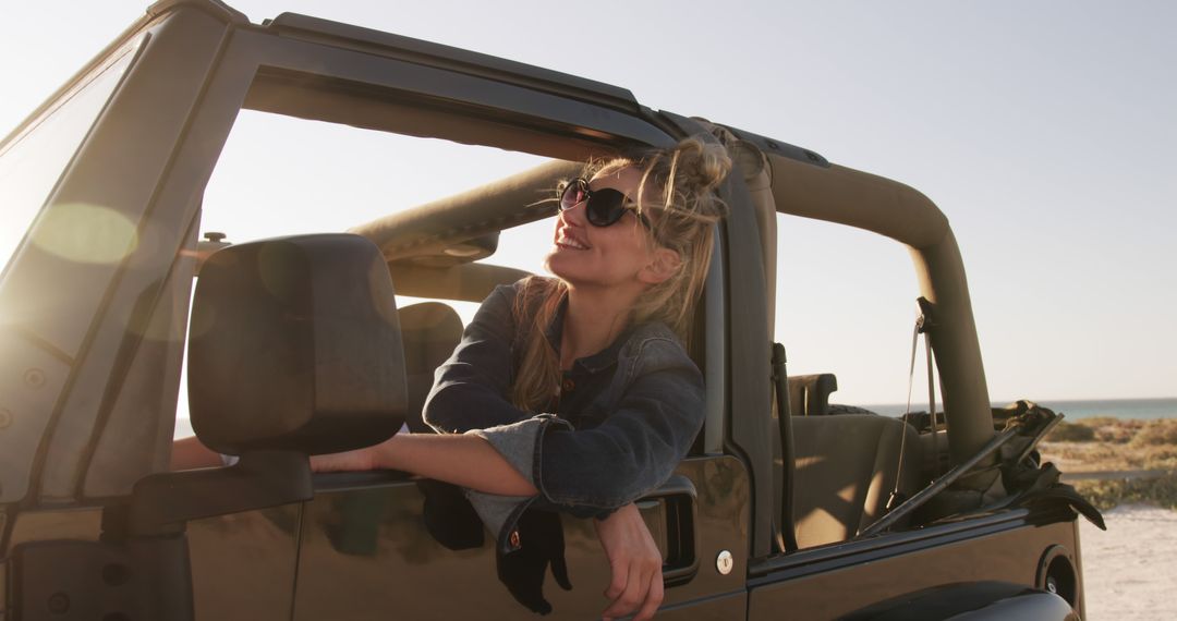 Woman Enjoying Road Trip in Convertible Jeep At Sunset - Free Images, Stock Photos and Pictures on Pikwizard.com