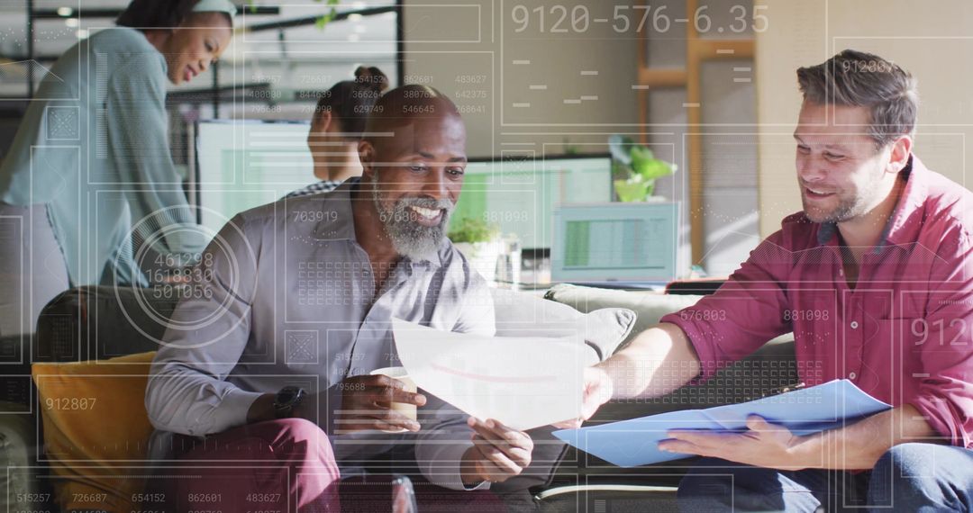 Colleagues Analyzing Reports in Modern Tech Office Environment
