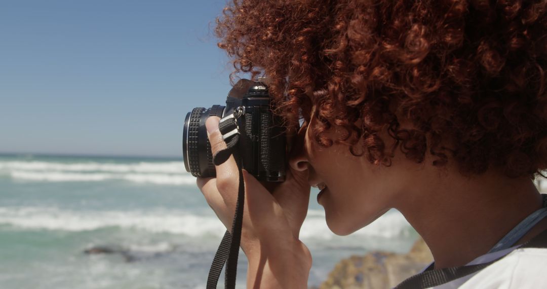 Woman Photographing Ocean Waves on Sunny Beach - Free Images, Stock Photos and Pictures on Pikwizard.com