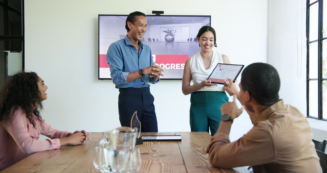 Diverse Team Discussing and Celebrating in Modern Office Space