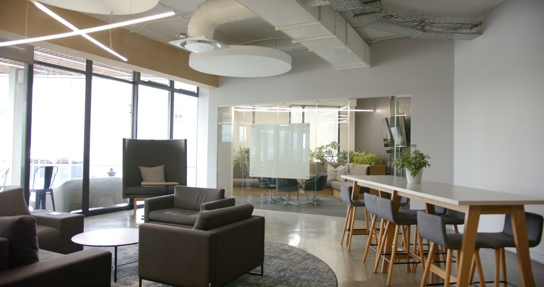 Modern Office Lounge with Comfortable Seating and Natural Light