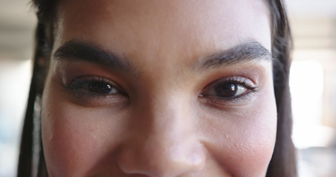 Woman Gazing With Subtle Eye Makeup in Soft Daylight
