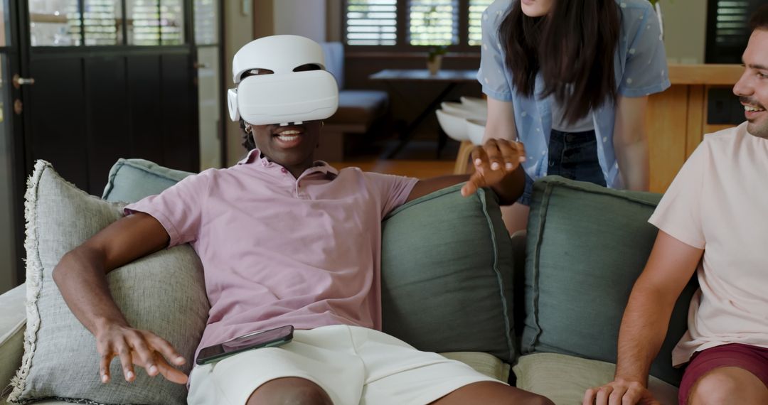 Friends Enjoying Virtual Reality in Comfortable Living Room
