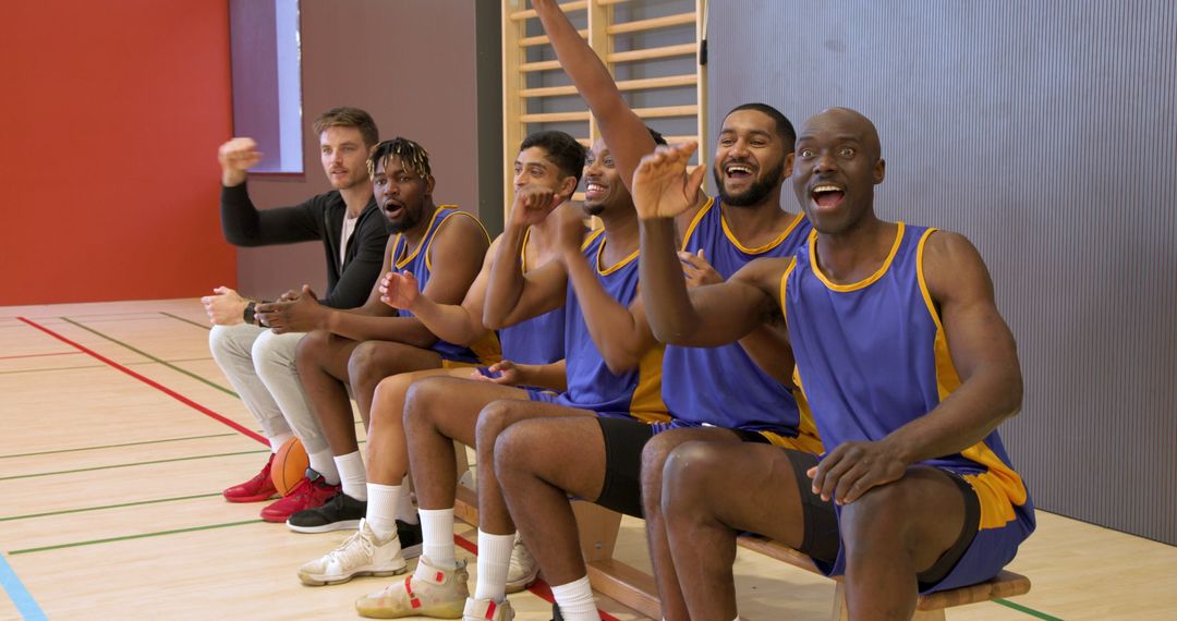 Basketball Team Celebrating with Excitement from Bench