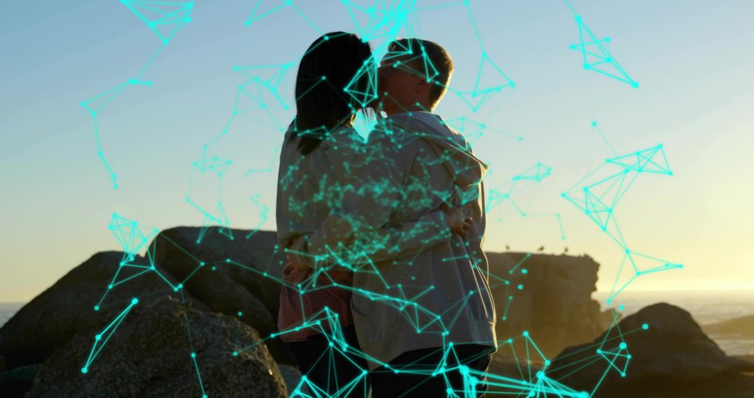 Couple Embracing on Rocks at Sunset with Abstract Blue Network