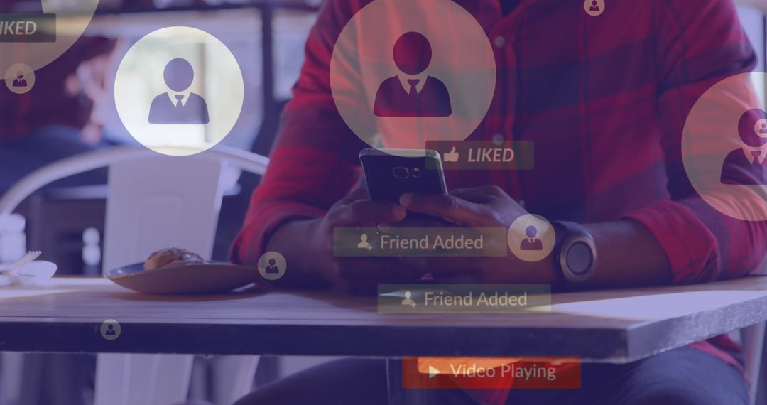 Man Engaged with Social Media on Smartphone at Cafe