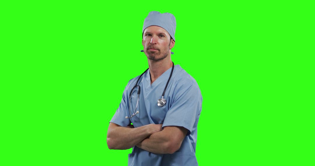 Confident Male Doctor In Scrubs With Stethoscope Against Green Screen - Free Images, Stock Photos and Pictures on Pikwizard.com