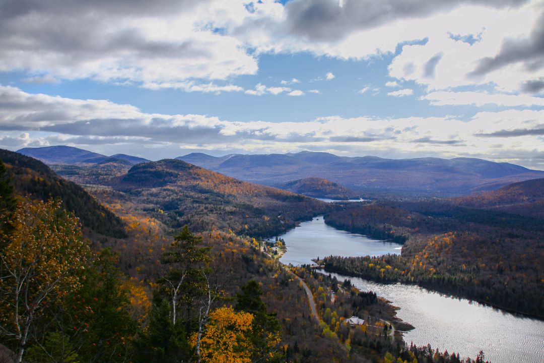 Scenic Aerial View of Mountain Lake Surrounded by Autumn Trees - Free Images, Stock Photos and Pictures on Pikwizard.com