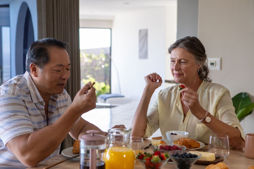 Senior Couple Enjoying Relaxed Breakfast at Home