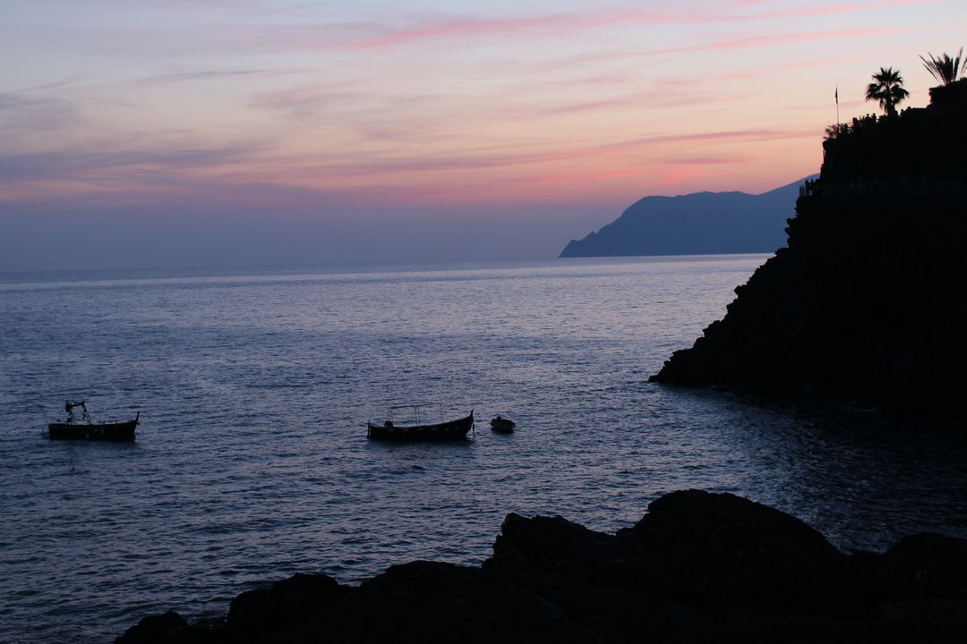 Peaceful Sunset on Coastal Horizon with Boats - Free Images, Stock Photos and Pictures on Pikwizard.com