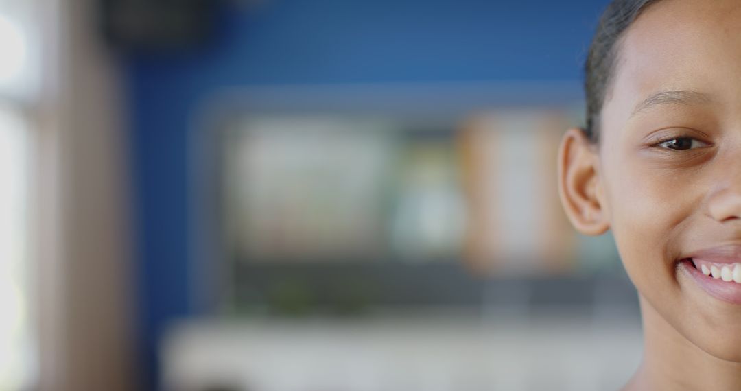 Half Face of Smiling Student in School Classroom with Bright Atmosphere