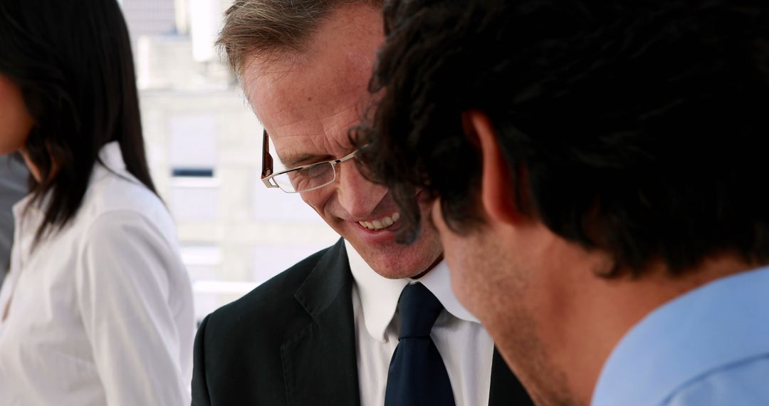 Business Professionals Strategizing Project in Modern Office