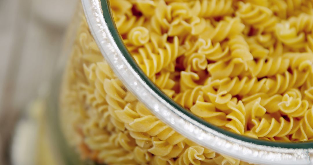 Close Up of Uncooked Fusilli Pasta in Glass Jar - Free Images, Stock Photos and Pictures on Pikwizard.com