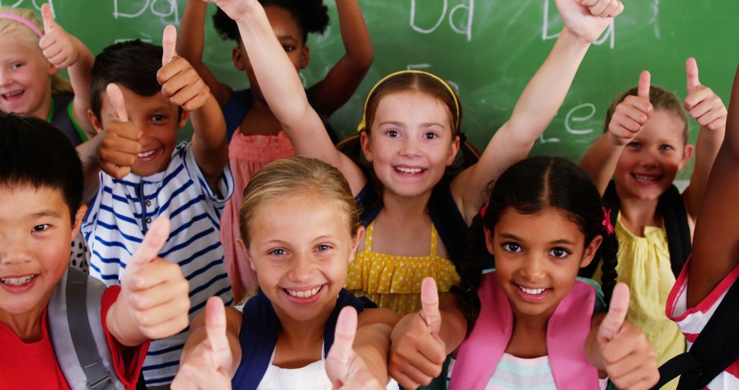 Diverse Students in Classroom Giving Thumbs Up